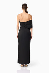 Brunette model wearing Dandelione Strapless Gown in Black back shot