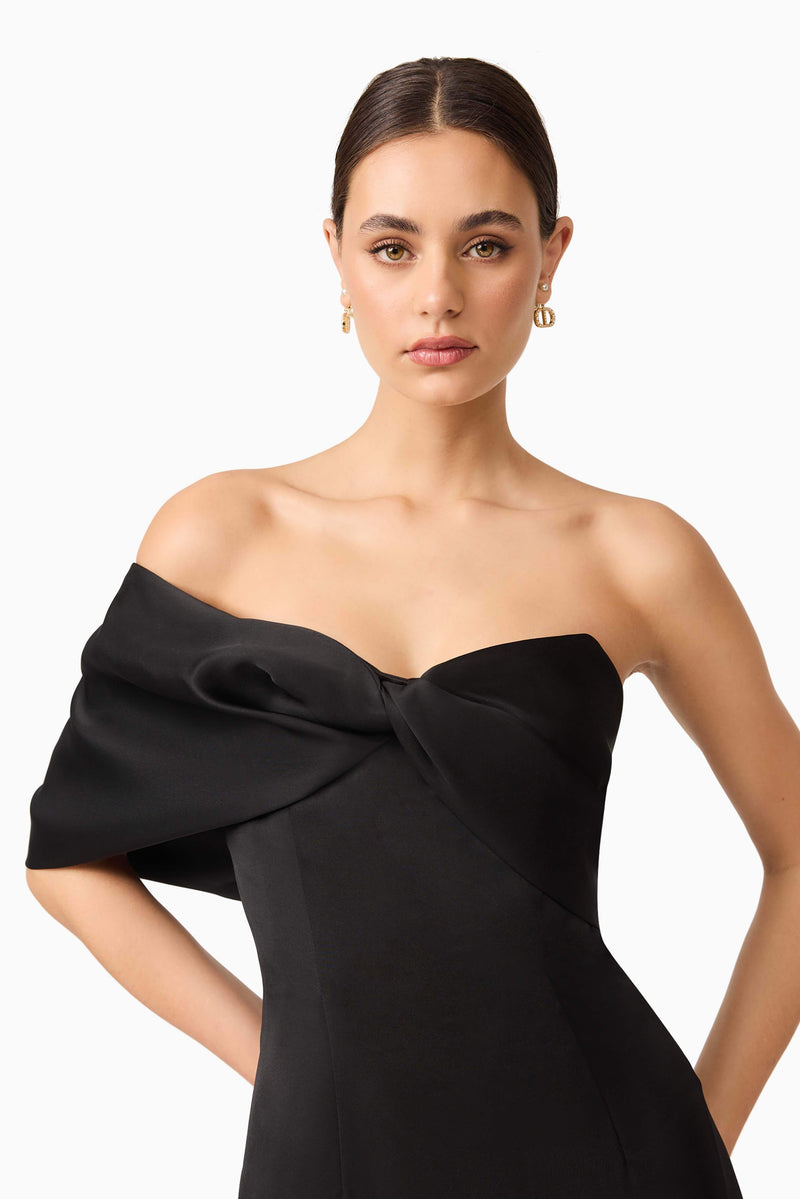 Brunette model wearing Dandelione Strapless Gown in Black close up shot