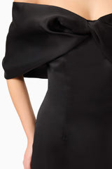 Brunette model wearing Dandelione Strapless Gown in Black detail shot