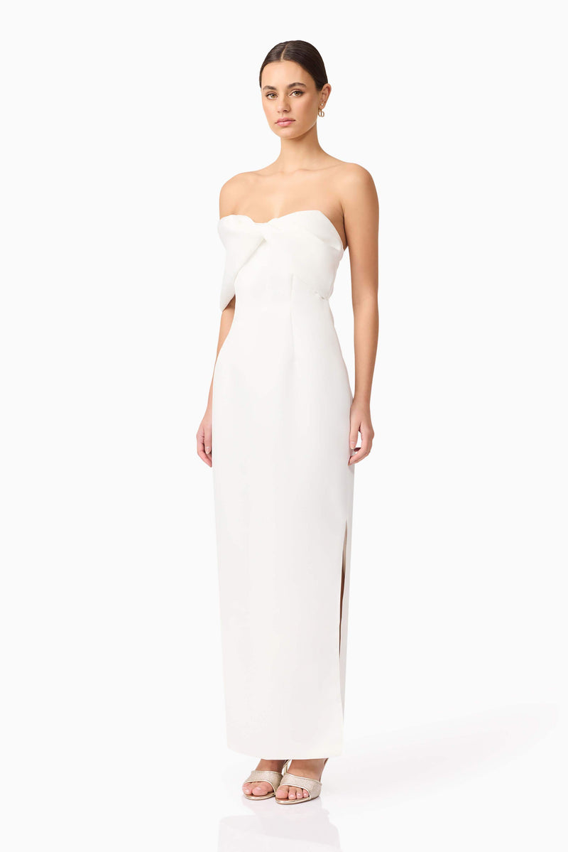 Brunette model wearing Dandelion Strapless Gown in White side shot