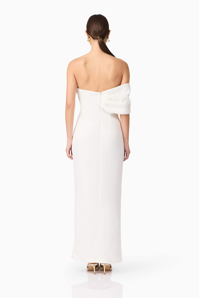 Brunette model wearing Dandelion Strapless Gown in White back shot