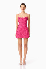 Brunette model wearing Claudia Party Dress in Pink front shot