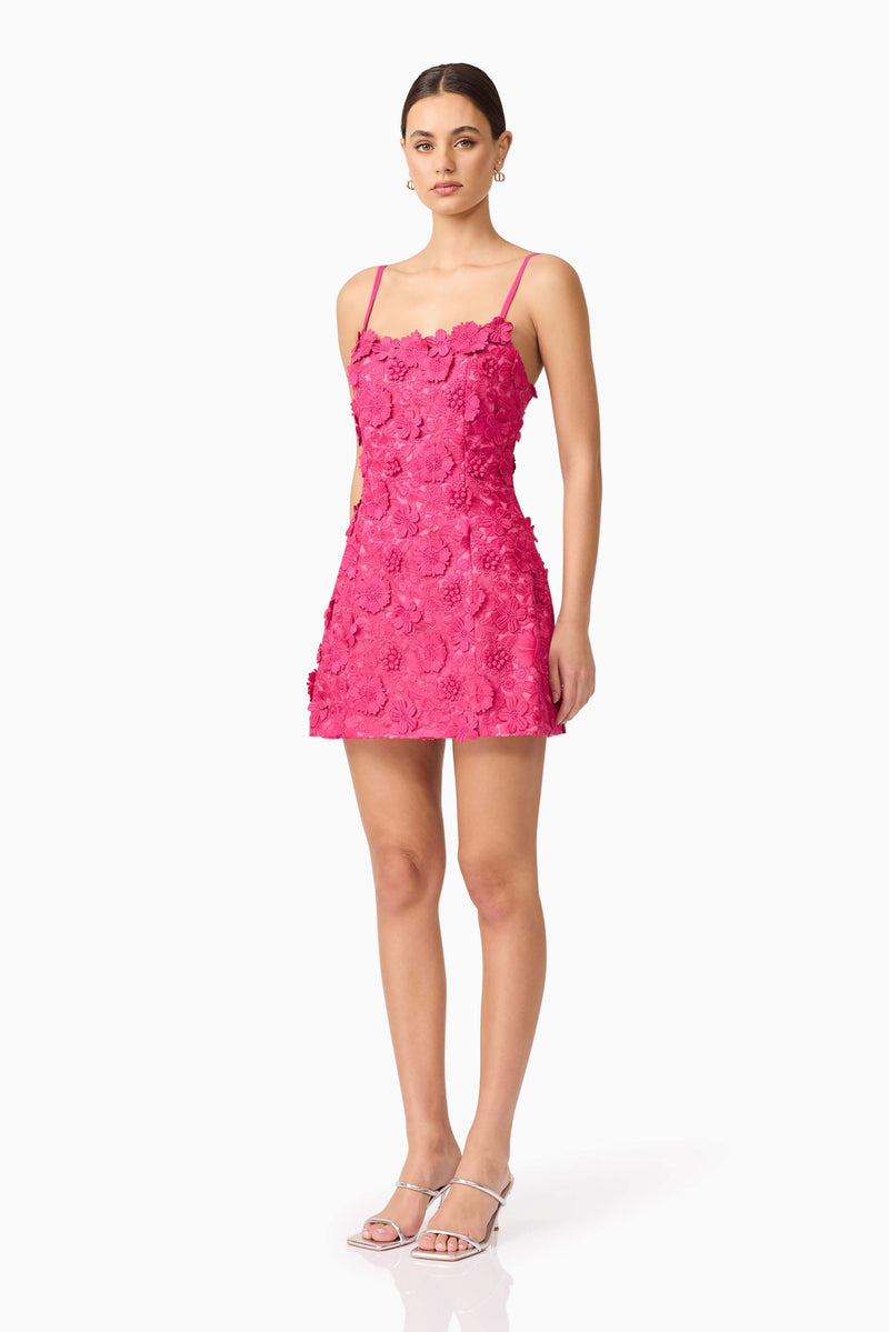 Brunette model wearing Claudia Party Dress in Pink side shot