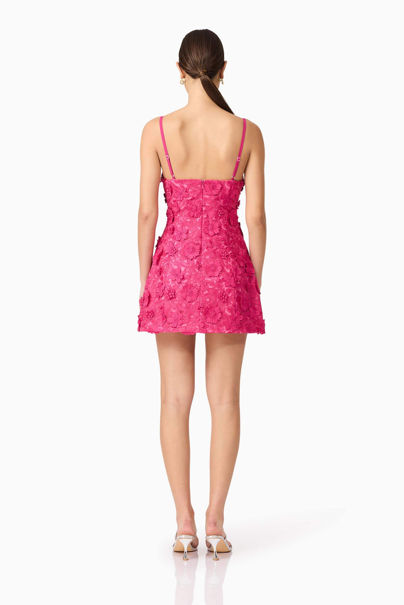Brunette model wearing Claudia Party Dress in Pink back shot
