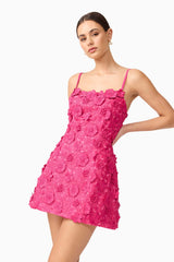 Brunette model wearing Claudia Party Dress in Pink close up posed shot