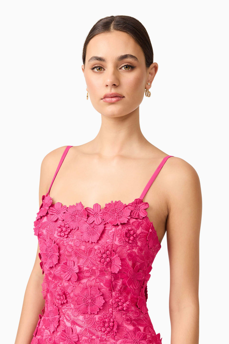 Brunette model wearing Claudia Party Dress in Pink close up shot