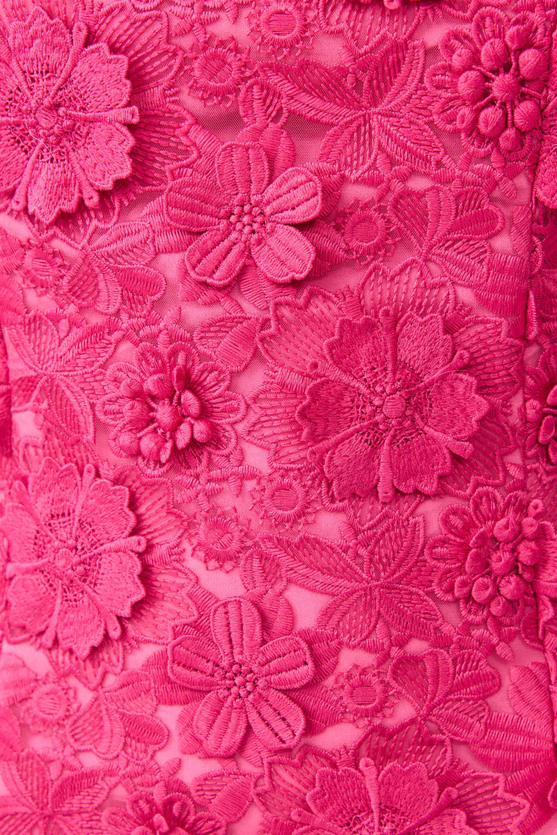 Brunette model wearing Claudia Party Dress in Pink detail shot