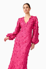 Brunette model wearing Claudia Long Sleeve Midi Dress in Pink close up posed shot