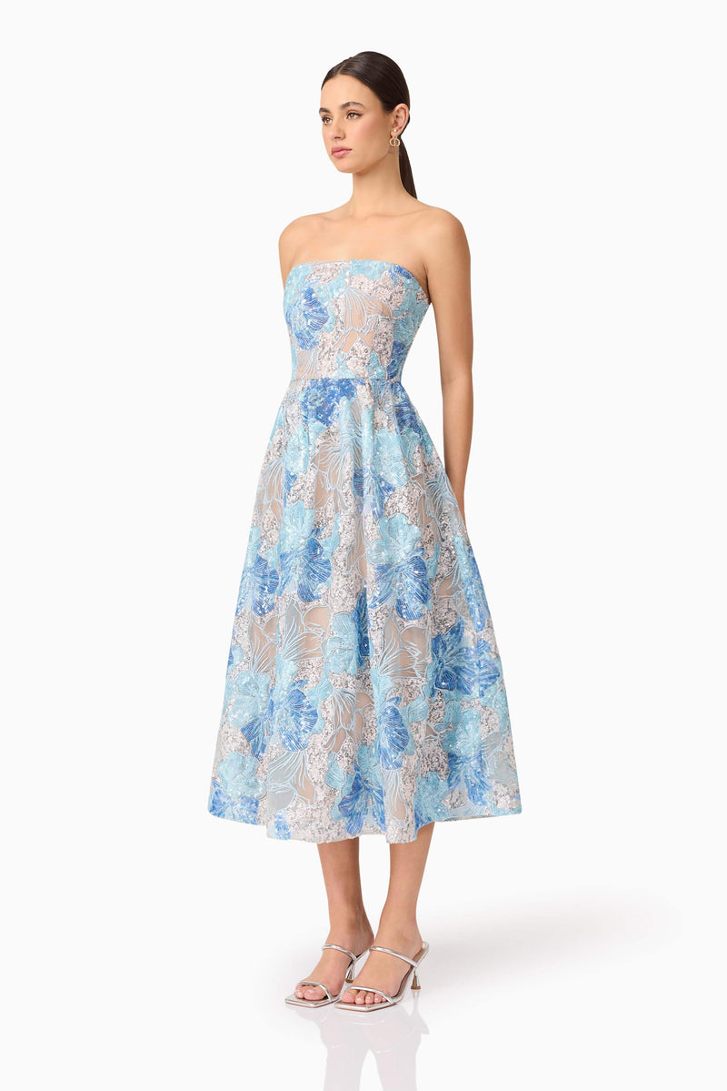 Brunette model wearing Leonie Cocktail Midi Dress in Blue side shot