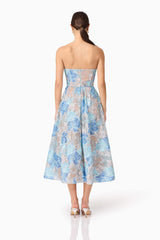 Brunette model wearing Leonie Cocktail Midi Dress in Blue back shot