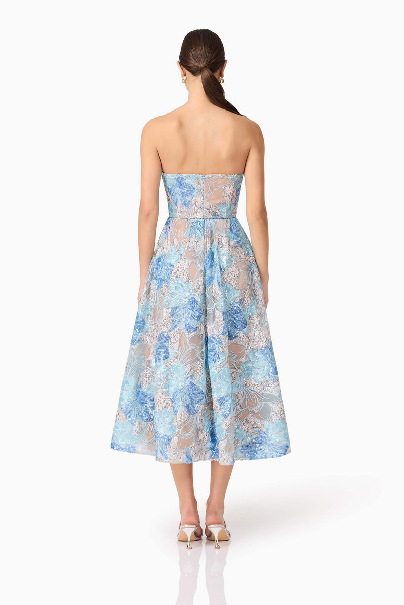 Brunette model wearing Leonie Cocktail Midi Dress in Blue back shot