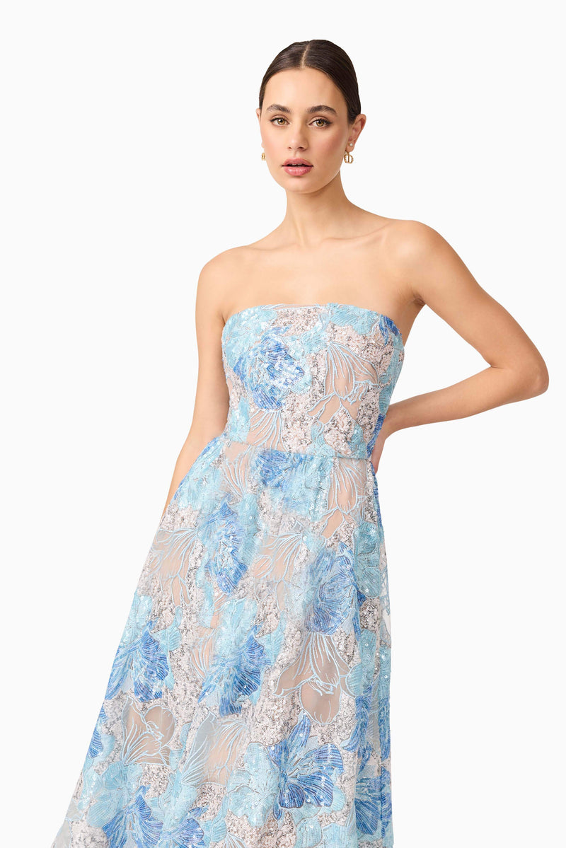 Brunette model wearing Leonie Cocktail Midi Dress in Blue close up shot