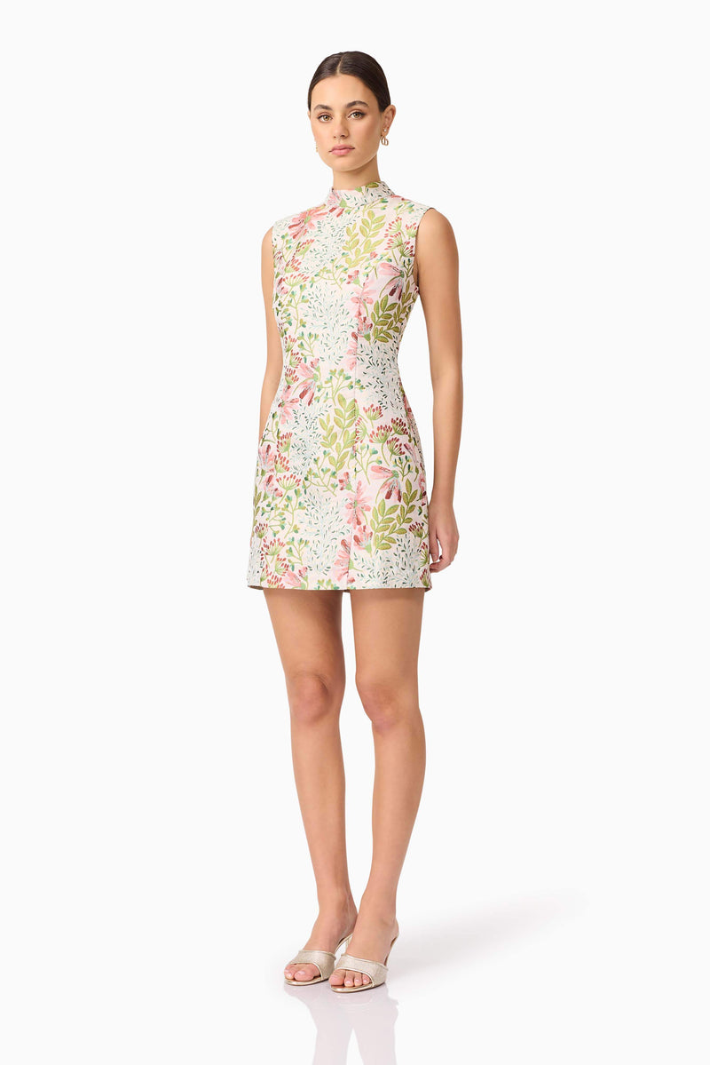 Brunette model in Calaantha Mini Dress in Floral side shot