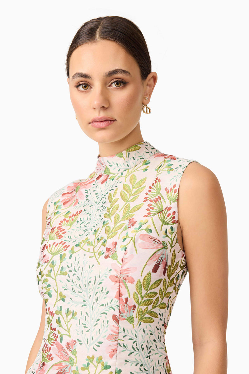 Brunette model in Calaantha Mini Dress in Floral pose close up shot