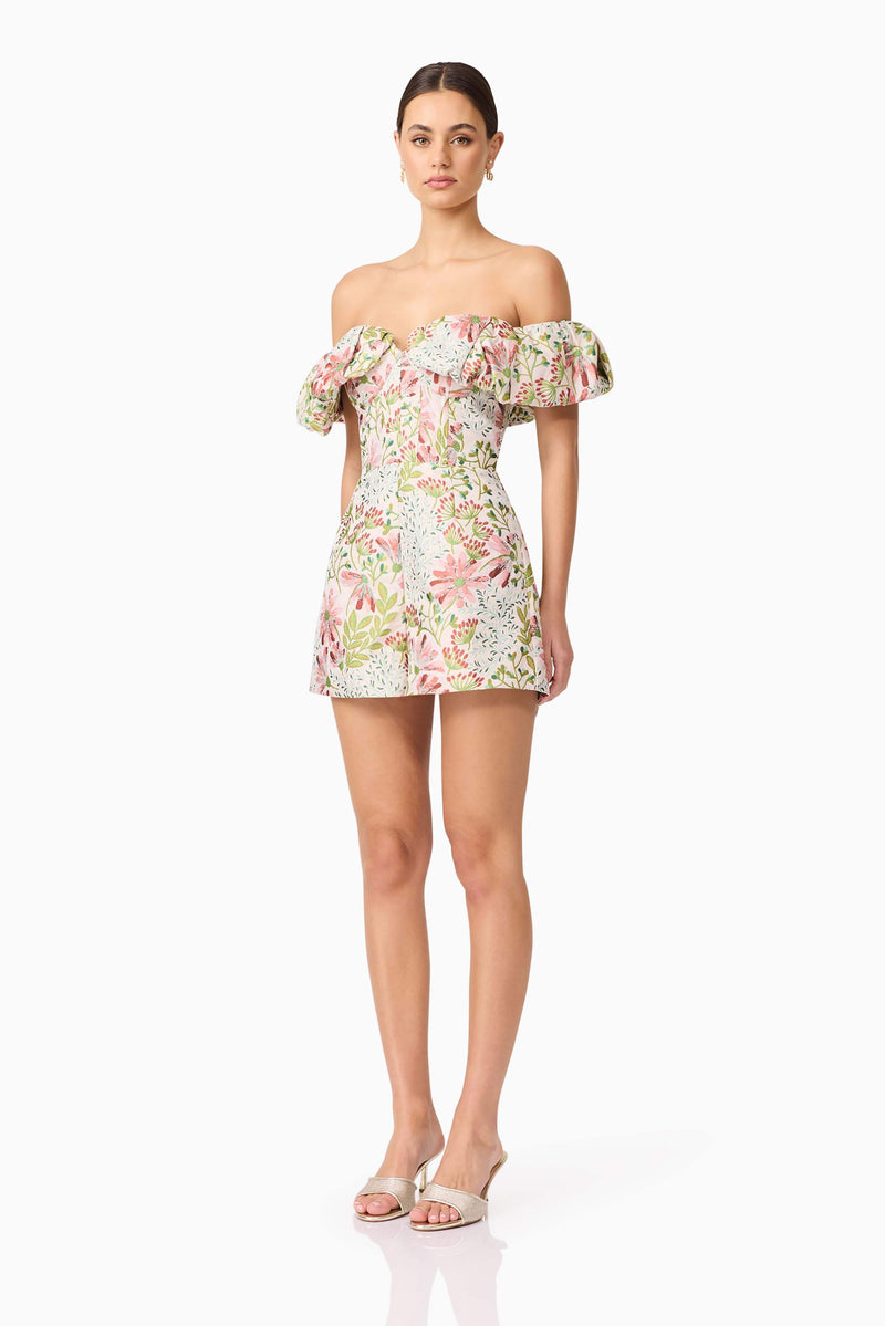 Brunette model in Calaantha Off The Shoulder Romper in Floral side view