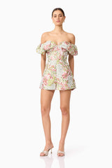 Brunette model in Calaantha Off The Shoulder Romper in Floral posing view