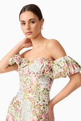 Brunette model in Calaantha Off The Shoulder Romper in Floral side pose