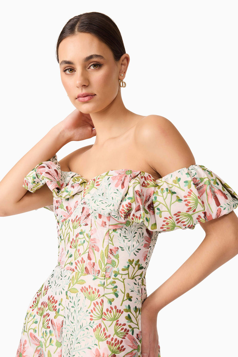 Brunette model in Calaantha Off The Shoulder Romper in Floral side pose