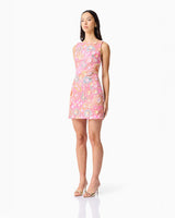Brunette model wearing the Nathalie Shift Mini Dress in Pink Floral side shot