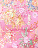 Brunette model wearing the Nathalie Shift Mini Dress in Pink Floral detail shot