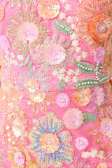 Brunette model wearing the Nathalie Colunm Midi Dress in Pink Floral detail shot