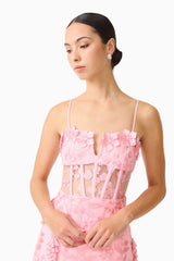 Brunette model wears the Monique Floral Applique Midi Dress in Pink close up detail shot