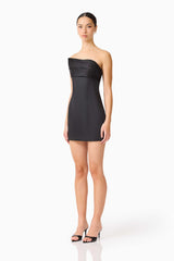 Brunette model wearing the Sydney Strapless Mini Dress in Black side shot 