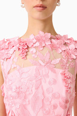 Brunette model wears Monique Floral Applique Midi in Pink detail shot