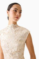 Brunette model wearing the Nicoletta High Neck Gown in Gold detail shot