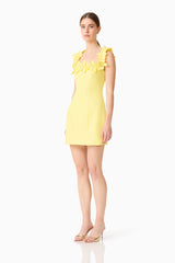 Brunette model wearing the Cara Square Neck Mini Dress in Yellow side shot 