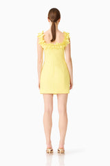 Brunette model wearing the Cara Square Neck Mini Dress in Yellow back shot 