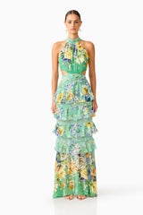 Brunette model wearing the Gardenia Halter Maxi Gown In Green front shot
