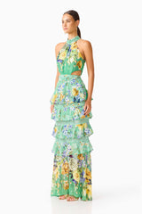Brunette model wearing the Gardenia Halter Maxi Gown In Green side shot