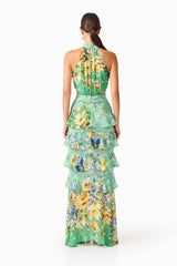 Brunette model wearing the Gardenia Halter Maxi Gown In Green back shot