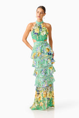Brunette model wearing the Gardenia Halter Maxi Gown In Green front posed shot