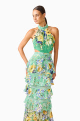 Brunette model wearing the Gardenia Halter Maxi Gown In Green close up posed shot