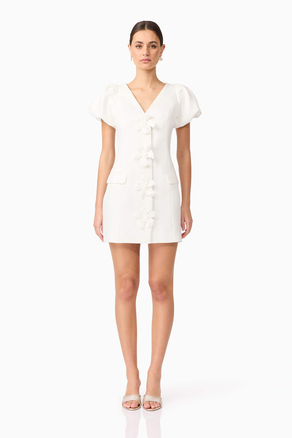 Brunette model wears Elysie Blazer Mini Dress in White front view