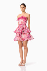 Brunette model wearing Evalina Floral Mini Dress in Pink side shot