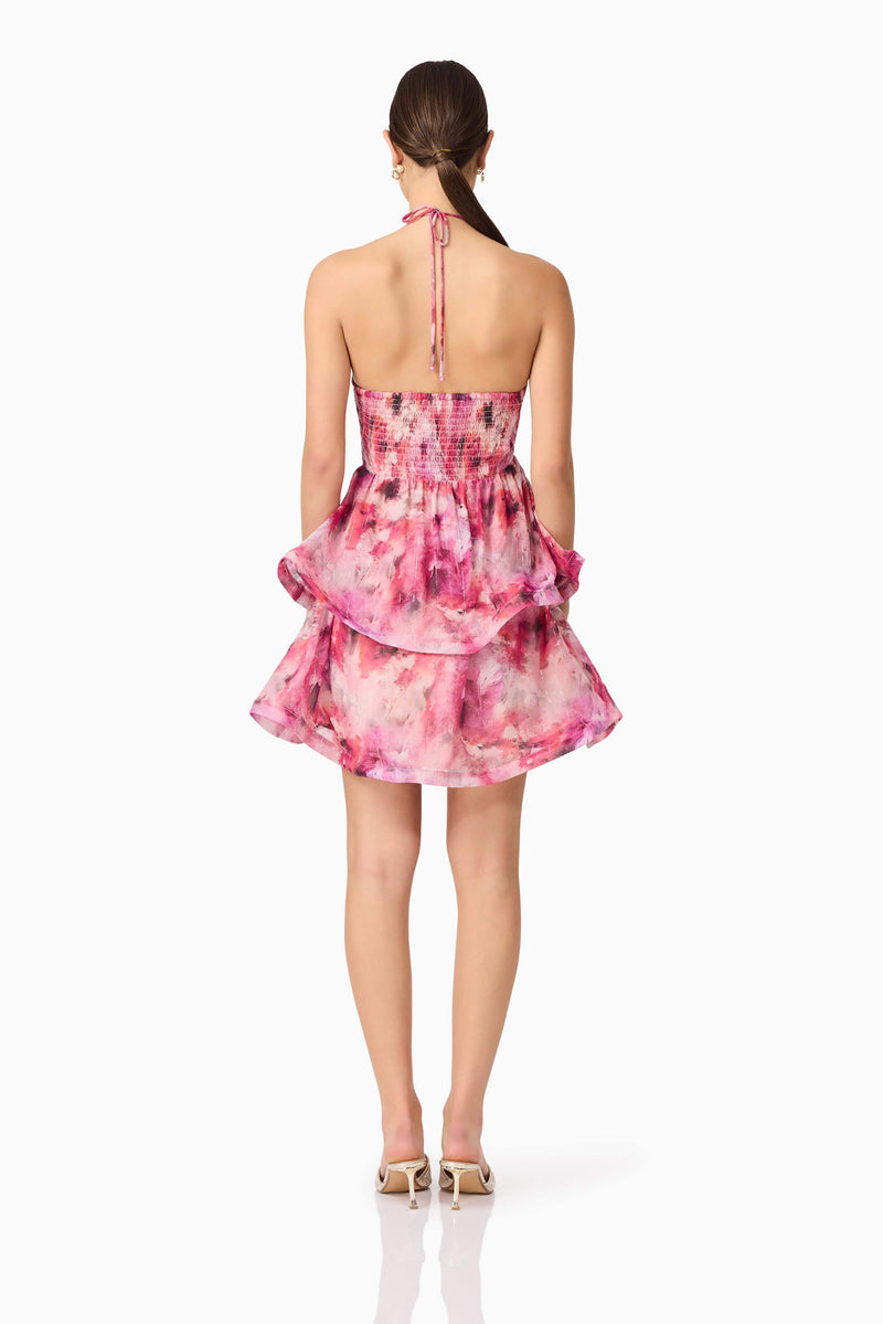 Brunette model wearing Evalina Floral Mini Dress in Pink back shot
