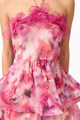Brunette model wearing Evalina Floral Mini Dress in Pink detail shot