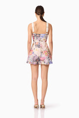 Brunette Model in Matila Mini Dress in Floral back View