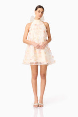 Brunette model wears Livia Trapeze Mini Dress in White front pose