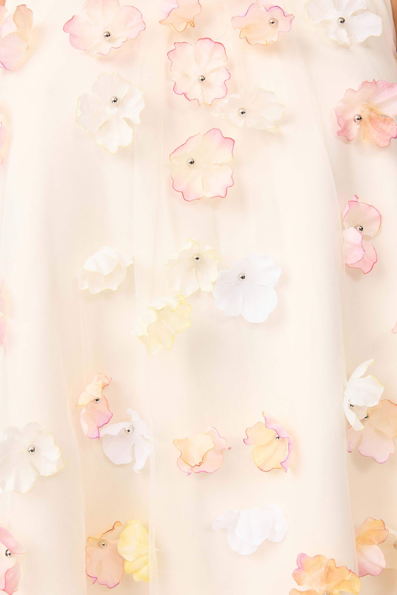 Brunette model wears Livia Trapeze Mini Dress in White detailed view