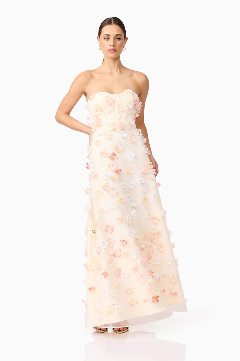 Brunette model wears Livia Maxi Dress in White front posing view