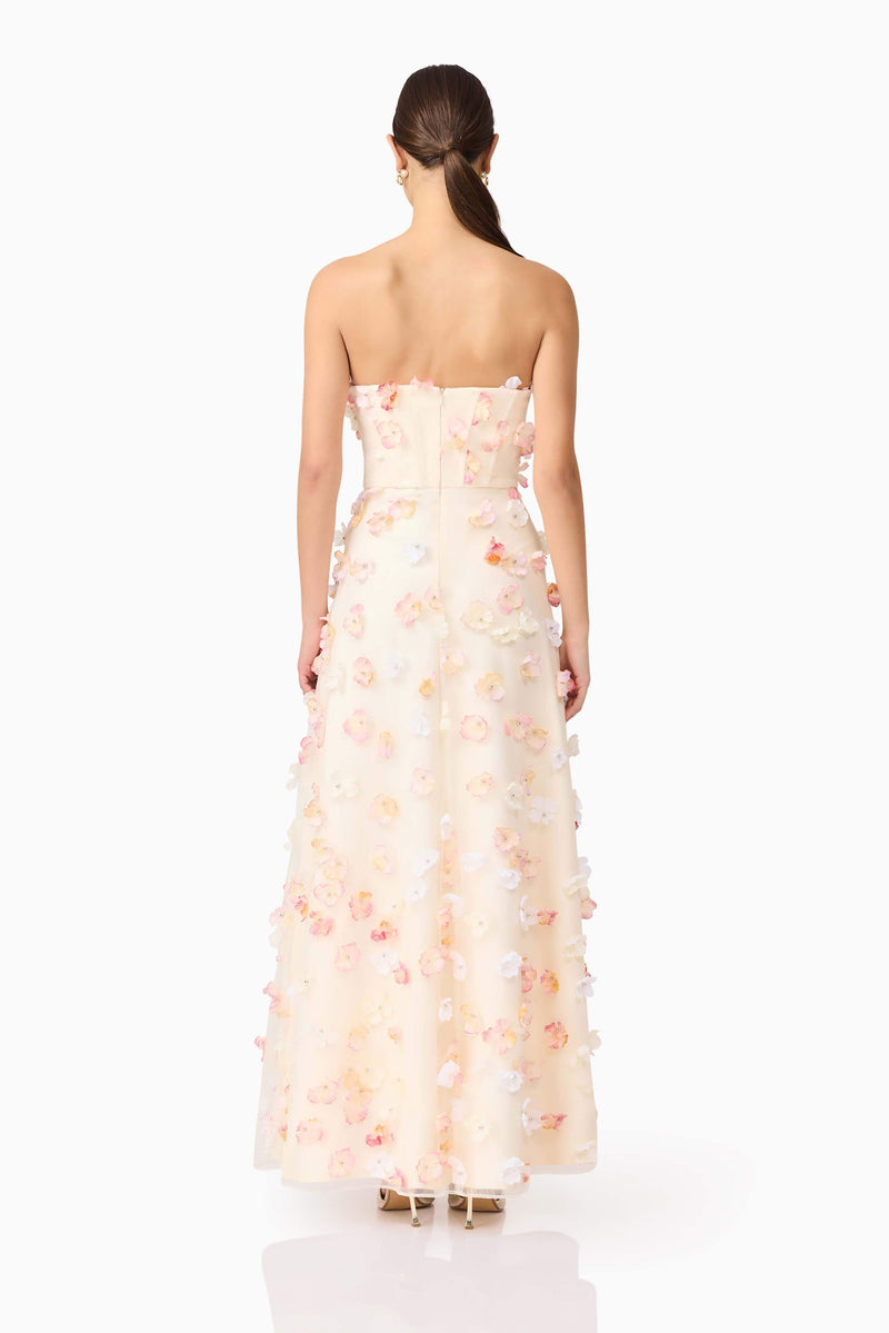 Brunette model wears Livia Maxi Dress in White back view