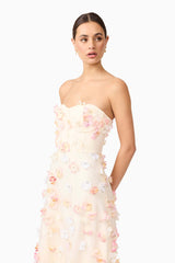 Brunette model wears Livia Maxi Dress in White close up side view