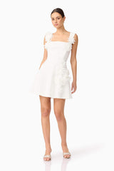 Brunette model wearing Jada Mini Dress in White posed shot