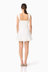 Brunette model wearing Jada Mini Dress in White back shot