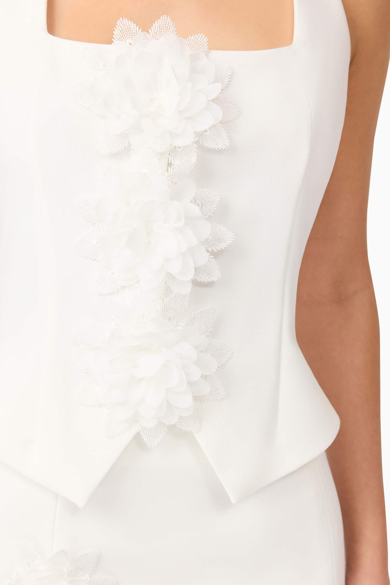 Brunette model wearing Jada Floral Set in White top detail shot