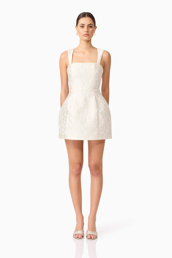 Brunette model wearing Galadirel Mini Dress in White front shot